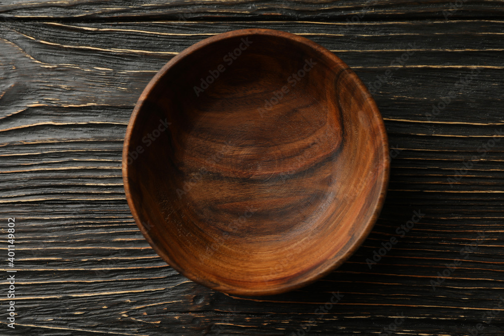 Empty wooden bowl on wooden table, top view Empty wooden bowl on wooden table, top view
