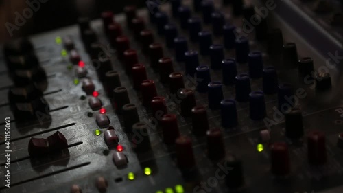 Sound mixer. Professional audio mixing console with lights, buttons, faders and sliders.