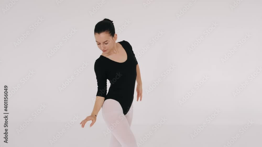 Isolated ballerin woman is dancing in white studio. Hobby, passion. Isolated ballerin woman is dancing in white studio. Hobby, passion.