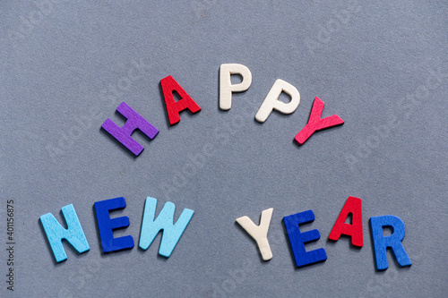 Happy new year font art colorful texting for greeting or celebrate card with gray background, Sensitive Focus