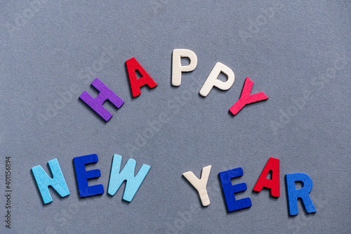 Happy new year font art colorful texting for greeting or celebrate card with gray background, Sensitive Focus