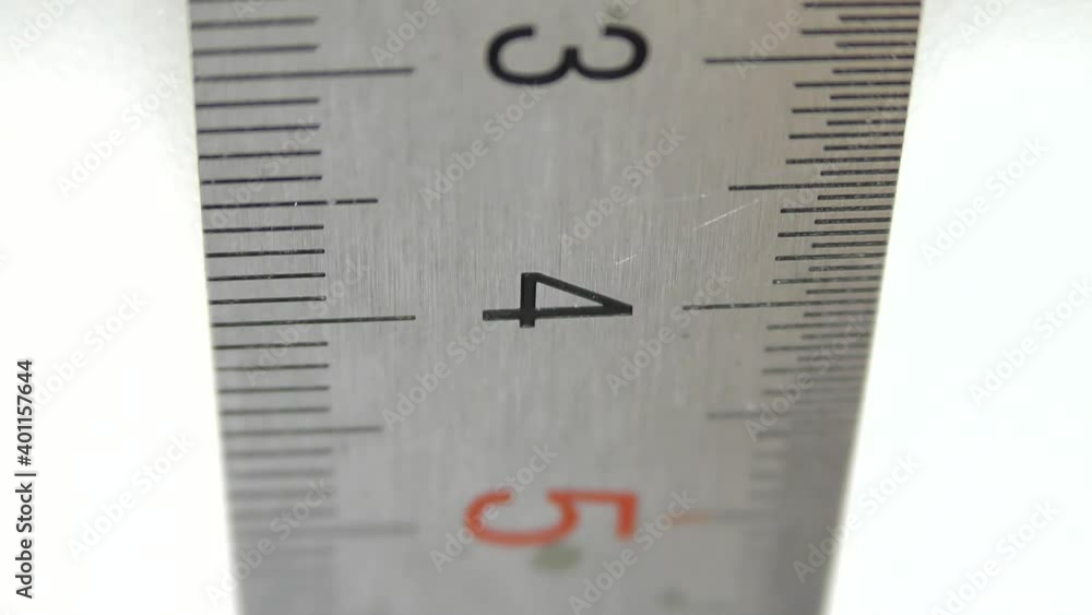 Stainless steel millimeter ruler on a white background. Stainless steel millimeter ruler on a white background.