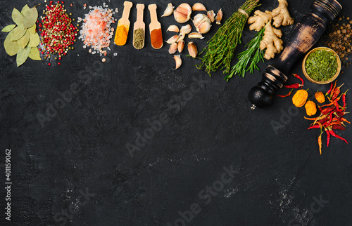 Fototapeta Naklejka Na Ścianę i Meble -  Assortment of spice and seasonings scattered on black background
