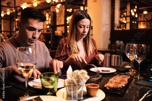 Young couple on a date at restaurant.