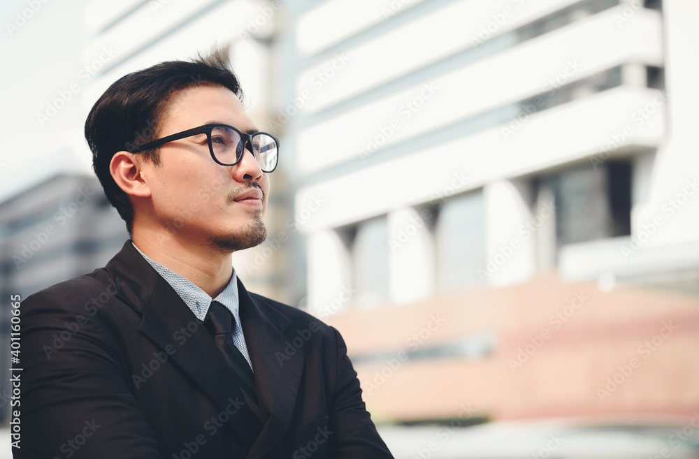 A young businessman committed to his business in the big city. A young businessman committed to his business in the big city.