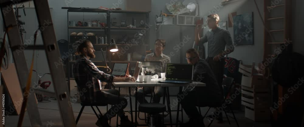 WIDE Young people having heated argument during brainstorm. Launching their small IT business startup company from garage. Shot with 2x anamorphic lens WIDE Young people having heated argument during brainstorm. Launching their small IT business startup company from garage. Shot with 2x anamorphic lens