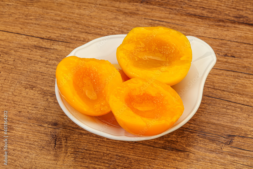 Marinated peaches fruit in the bowl