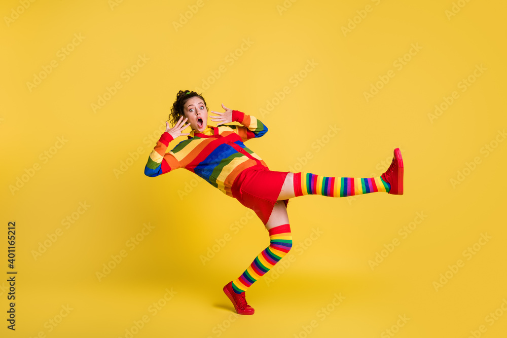 Profile photo of shocked lady felling down slippery floor wear striped sweater short skirt knee socks shoes isolated yellow color background Profile photo of shocked lady felling down slippery floor wear striped sweater short skirt knee socks shoes isolated yellow color background