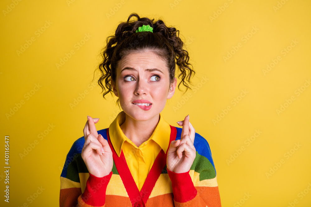 Pretty lady look side crossed fingers expect results wear rainbow sweater isolated yellow color background Pretty lady look side crossed fingers expect results wear rainbow sweater isolated yellow color background
