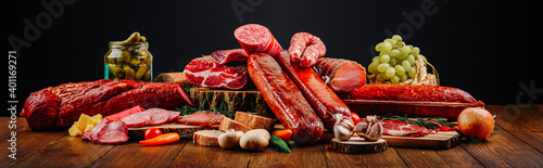 Meat and sausage cuts with a cool juicy background