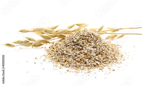 Oat bran pile and ears on stalk, groats isolated on white background