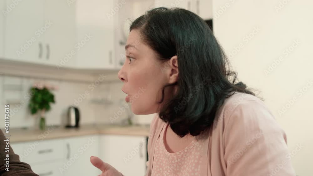 Angry daughter shouting at aged father, generation gap, family problem, conflict Angry daughter shouting at aged father, generation gap, family problem, conflict