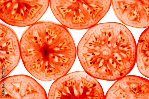 Fresh red tomatoes round pieces slices isolated on white background. 