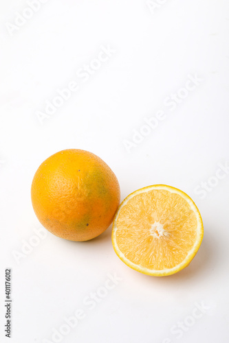 Fresh Half cut sweet lemon or mosambi fruit on white background