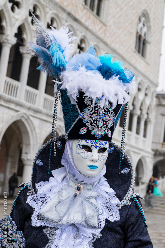 Venice, Italy - February 17, 2020: An unidentified woman in a carnival costume in Piazza San Marco attends at the Carnival of Venice.