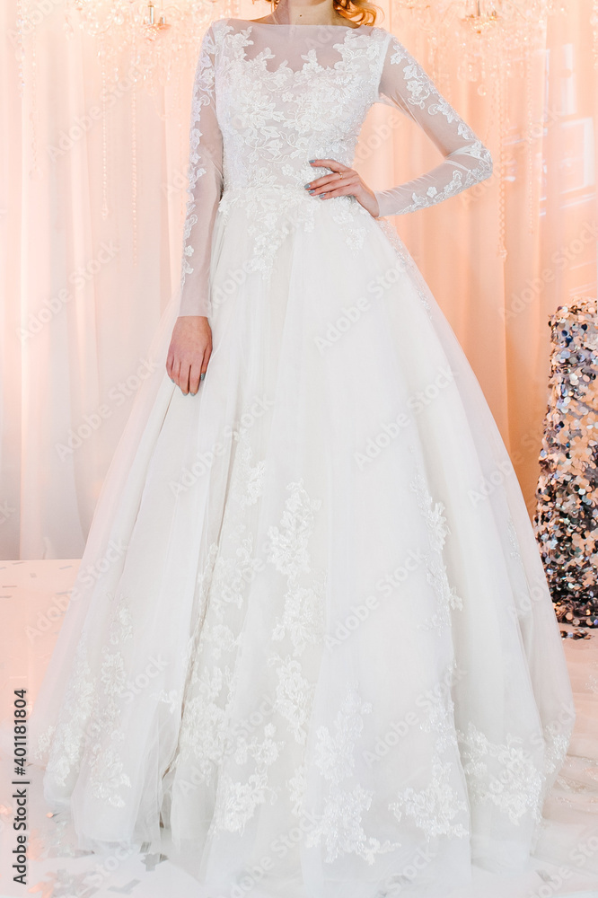 Bride in expensive, luxury dress at ceremony in wedding day. Woman, details of models on the collection. Bride in expensive, luxury dress at ceremony in wedding day. Woman, details of models on the collection.