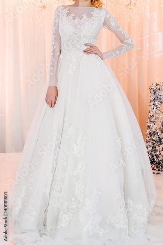 Bride in expensive, luxury dress at ceremony in wedding day. Woman, details of models on the collection.