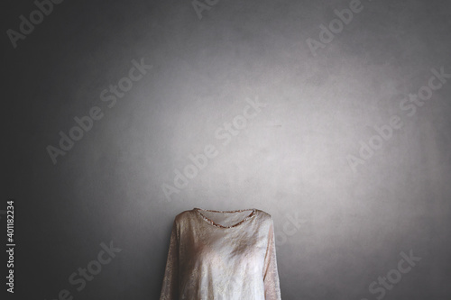 invisible woman with no face wearing a blouse, concept of losing identity