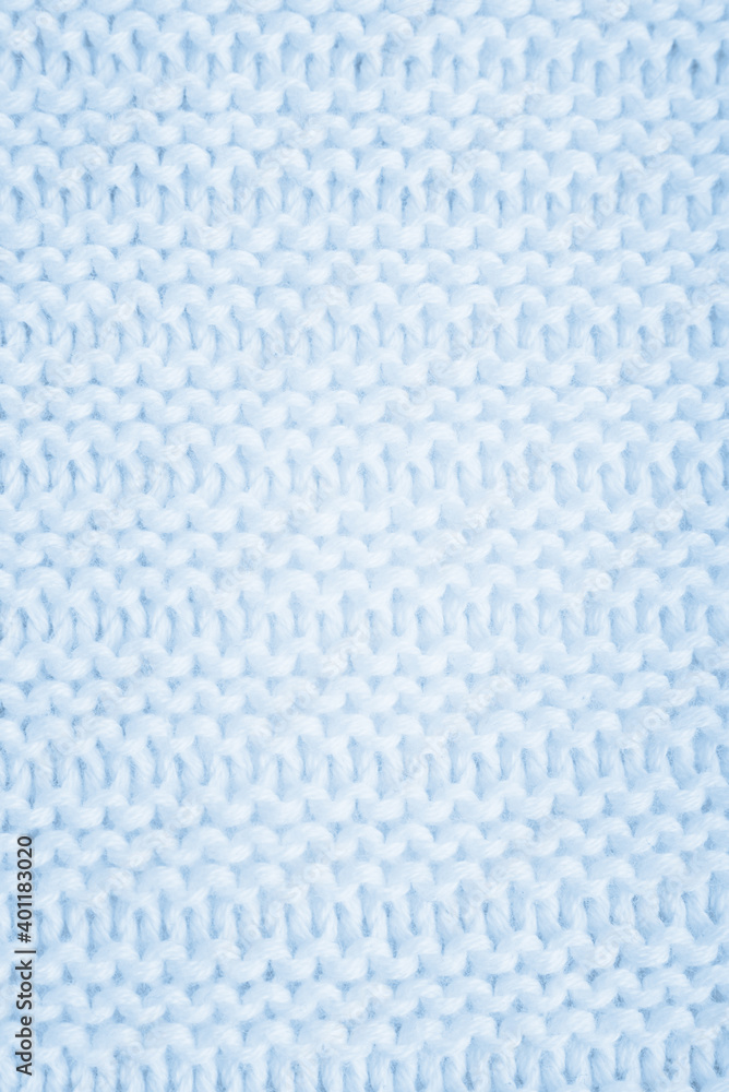 Close up of blue knitted textured background. Trendy color.