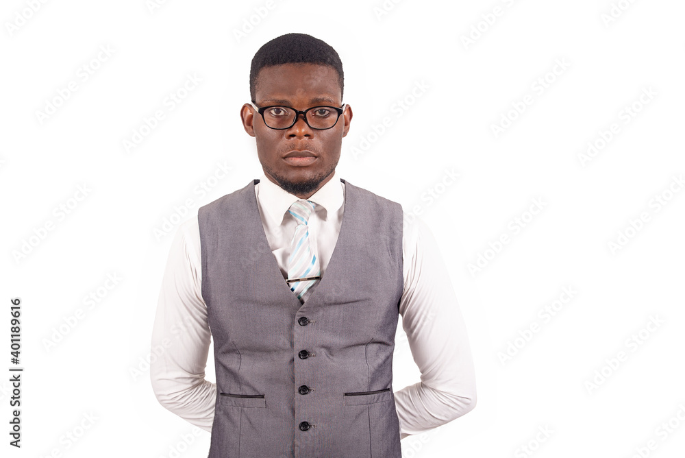 young businessman standing with hands behind his back young businessman standing with hands behind his back