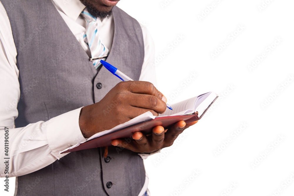 close up of a handsome businessman with diary close up of a handsome businessman with diary