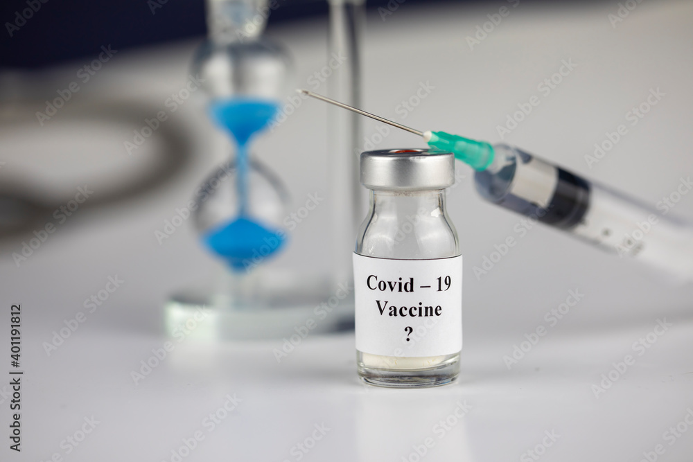 Pandemic and time Concept , Time to Vaccinate. Vaccine Bottle with Syringe for Covid-19 and hourglass
Pandemic and time Concept , Time to Vaccinate. Vaccine Bottle with Syringe for Covid-19 and hourglass