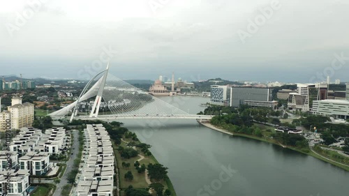 Aerial push-in shot of Seri Wawasan Bridge on cloudy day in Malaysia photo