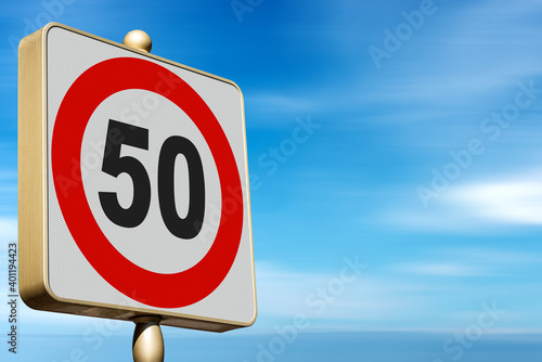 Closeup of a modern Road Sign Speed Limit 50 Kmh (kilometers per hour), on blue sky with clouds and copy space.