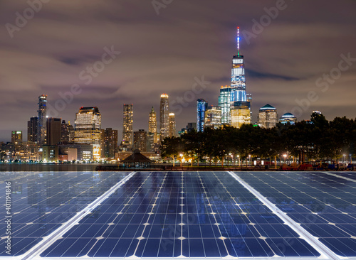 Solar panel over cityscapes, solar power green energy for life concept,New York City USA,