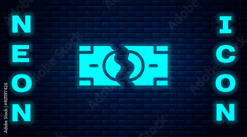 Glowing neon Tearing apart money banknote into two peaces icon isolated on brick wall background. Vector.