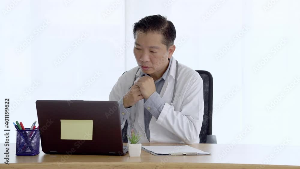 doctor talking to patient making video call on laptop. doctor male speaking looking at pc screen communicating by webcam in web chat consulting client online. Telemedicine concept doctor talking to patient making video call on laptop. doctor male speaking looking at pc screen communicating by webcam in web chat consulting client online. Telemedicine concept