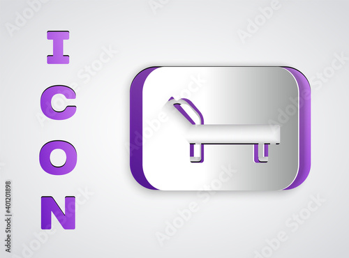 Paper cut Sunbed icon isolated on grey background. Sun lounger. Paper art style. Vector.