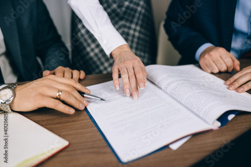 businessmen discuss documents in close-up with their hands