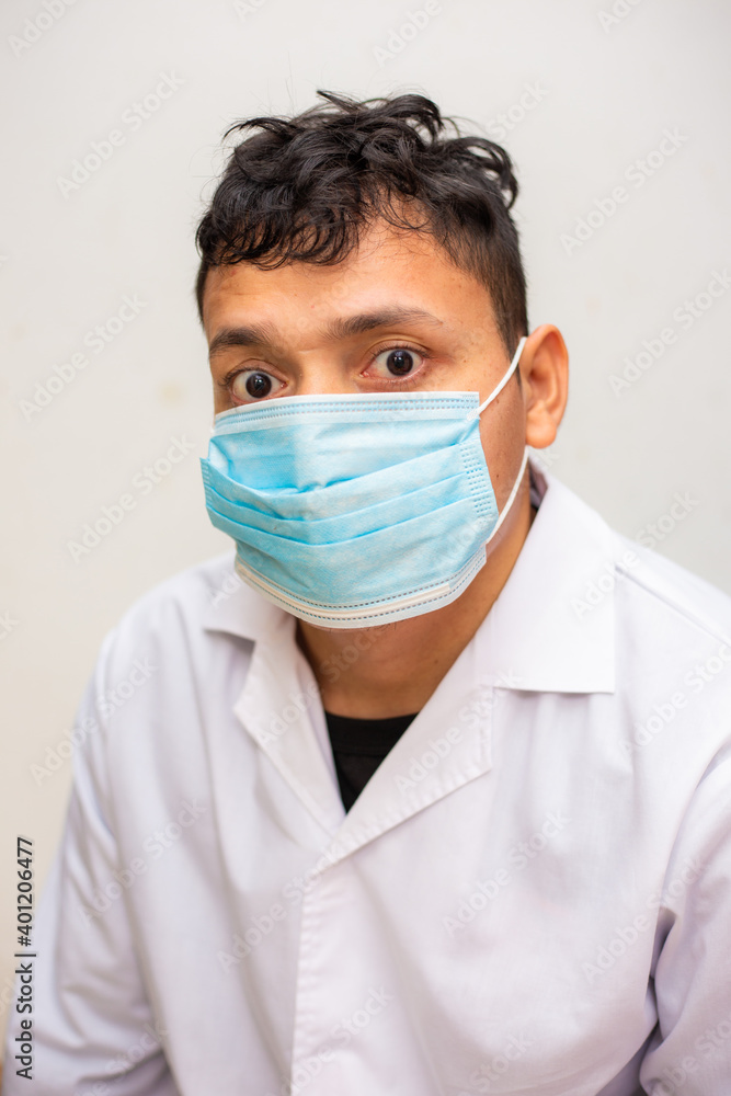 Portrait of young asian man wearing face protective medical mask for protection from virus disease Portrait of young asian man wearing face protective medical mask for protection from virus disease