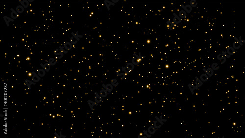 The dust is yellow. Yellow sparks and golden stars shine with special light. Vector sparkles on a black background. Christmas light effect. Sparkling magical dust particles