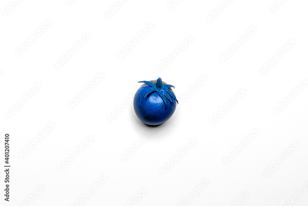 Blue tomato on a white clean background. Fancy products Blue tomato on a white clean background. Fancy products