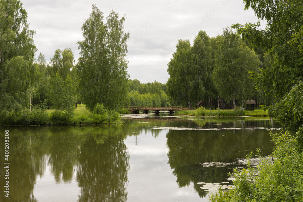 view of a beautiful pond in the Russian Art Park in Kostroma, photo was taken on a cloudy summer day