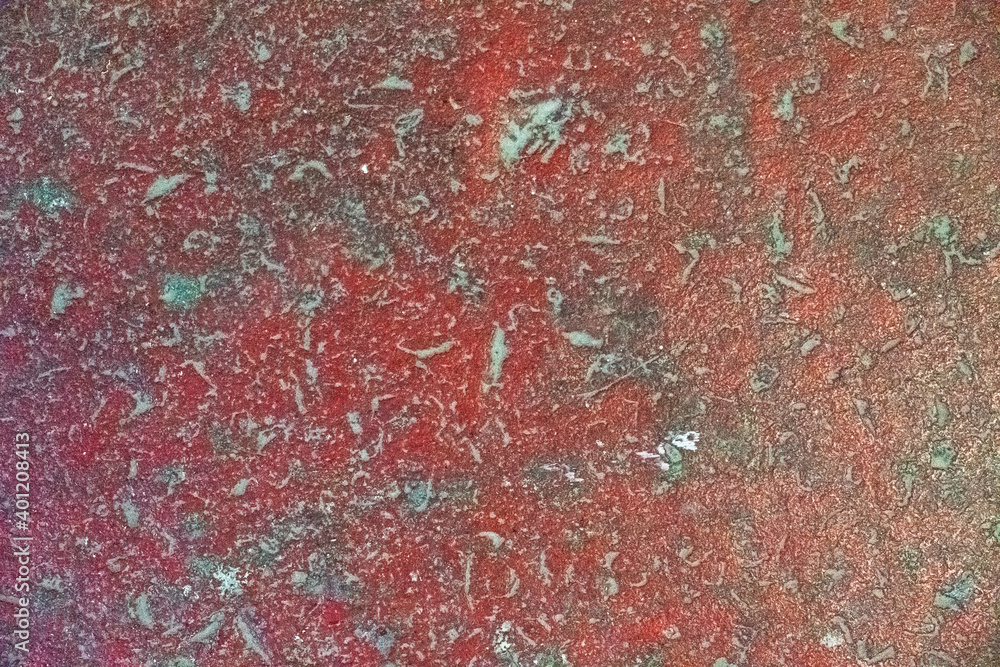 old red concrete wall with blue paint stains and deep relief. rough texture old red concrete wall with blue paint stains and deep relief. rough texture