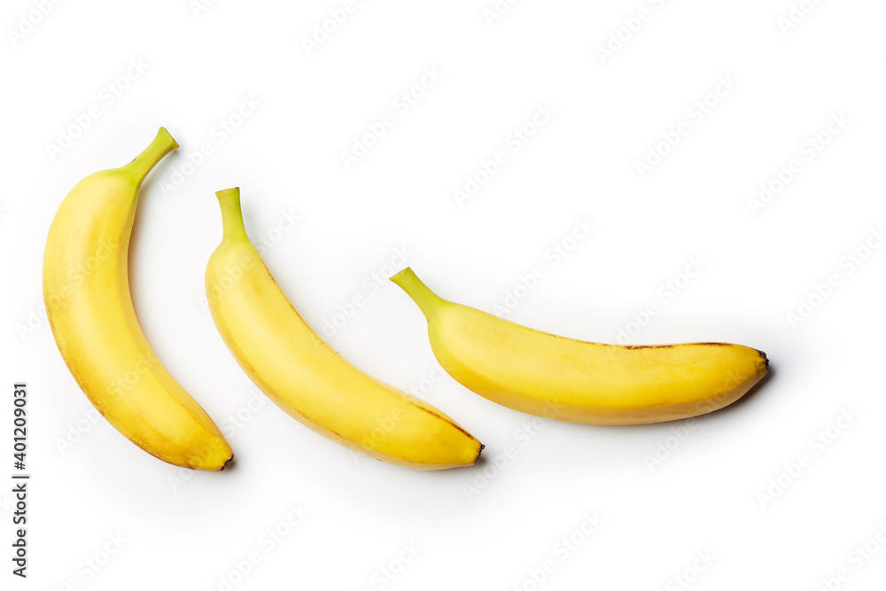 Three fresh raw clean isolated yellow bananas on the bright solid white fond background Three fresh raw clean isolated yellow bananas on the bright solid white fond background