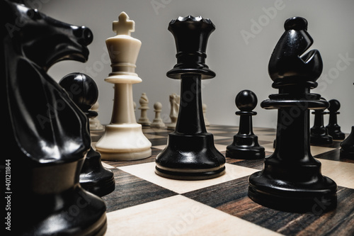 Chess figures on chess board macro photo