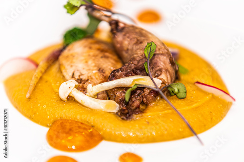 Duck thigh with mushrooms and sweet potato puree. The food in the restaurant. Food styling and restaurant meal serving.