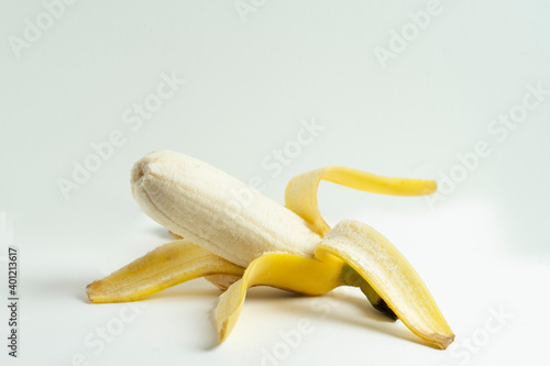 Close up open yellow banana isolated on white background