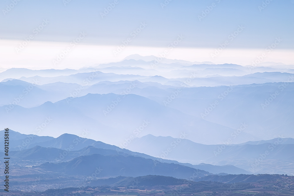 A mesmerizing scene of light blue layered mountains of Pico de Orizaba volcano in Mexico A mesmerizing scene of light blue layered mountains of Pico de Orizaba volcano in Mexico