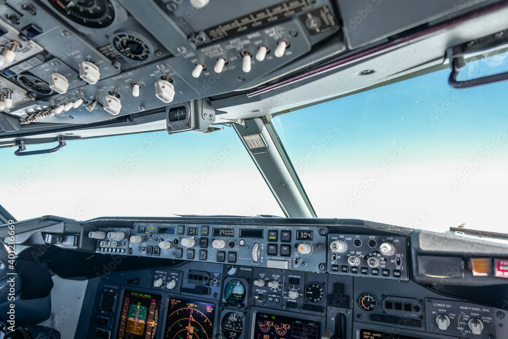 modern passenger airplane cockpit with blue sky in front 