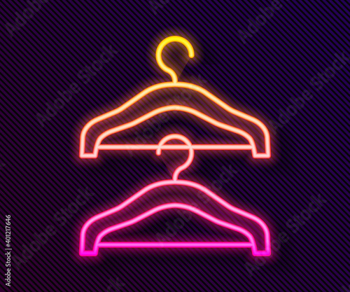 Glowing neon line Hanger wardrobe icon isolated on black background. Cloakroom icon. Clothes service symbol. Laundry hanger sign. Vector.