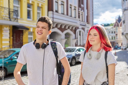 Youth, teenagers, lifestyle, portrait of smiling happy teenage boy and girl