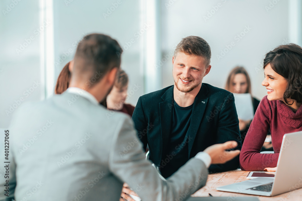 serious group of employees discussing working issues . serious group of employees discussing working issues .