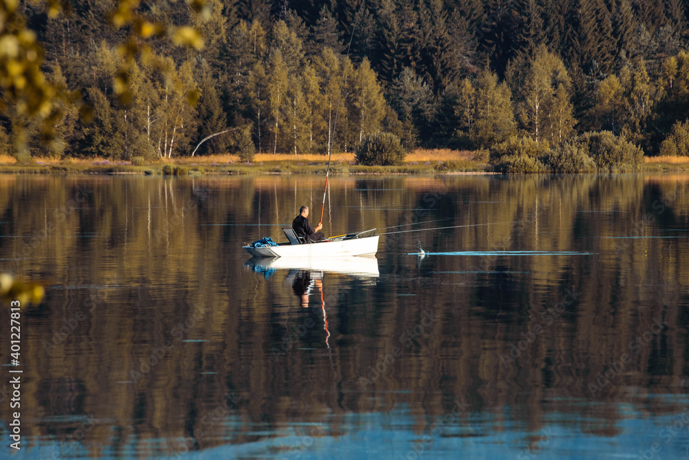 Fishing boat on the lake in the morning. Copy space