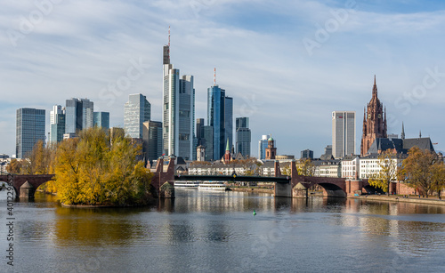 Frankfurt, Germany, November 2020: view on Frankfurt am Main, Germany Financial District and skyline, picture taken on bridge at main river © Alexander