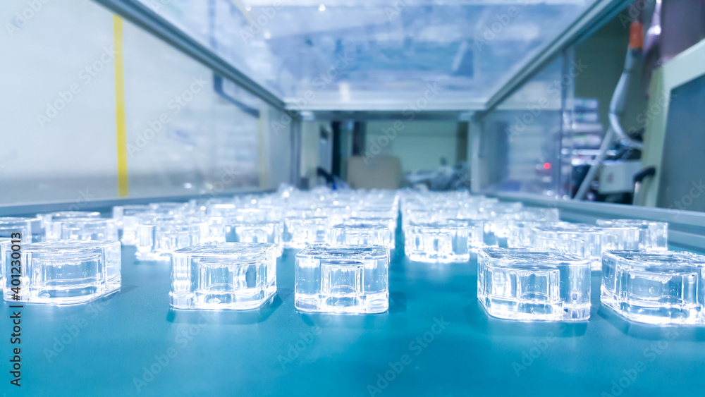 Parts of cosmetic plastic products on the production line in industrial factory.. Parts of cosmetic plastic products on the production line in industrial factory..
